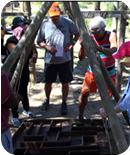 Hans directing his team blindfolded through a maze.